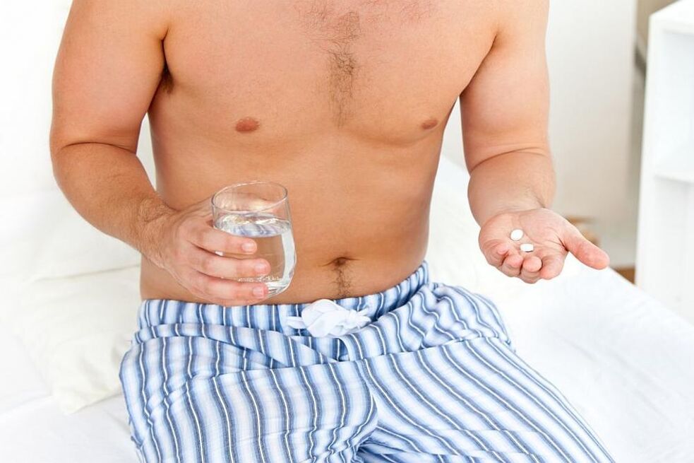 man takes pills for prostatitis